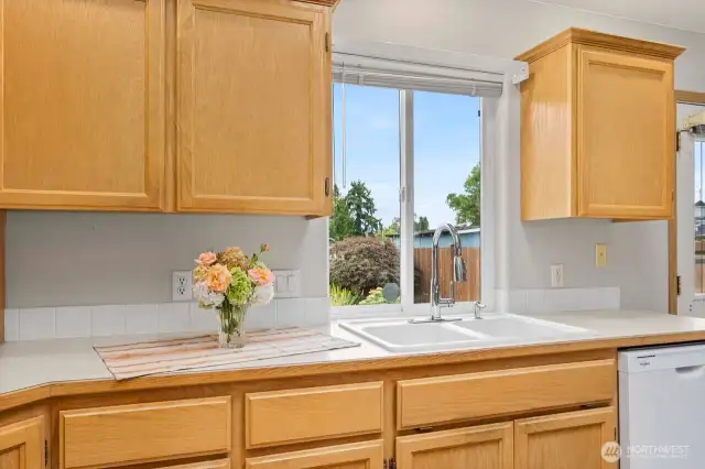 Nice big window over the kitchen sink adds plenty of light and a wonderful view of your backyard.