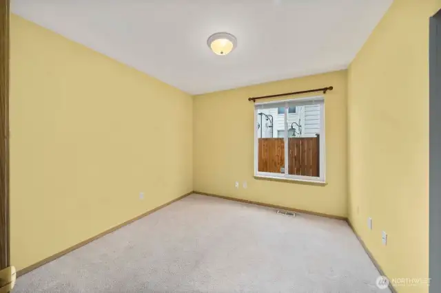 Secondary bedroom off hall. This faces the side of the house and there is a walk way between the house and the fence.