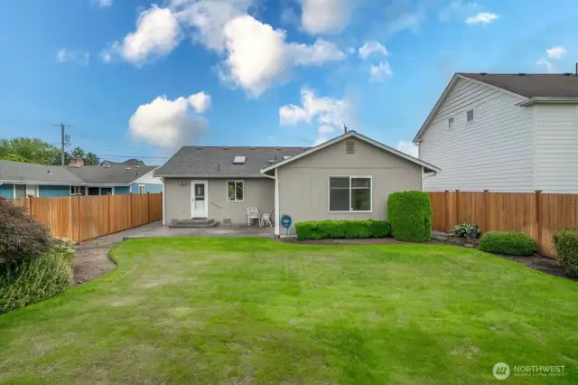 Fully fenced and gated back yard complete with front and back sprinkler system