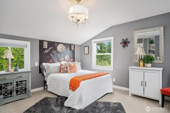 A light and bright bedroom is waiting for you upstairs.