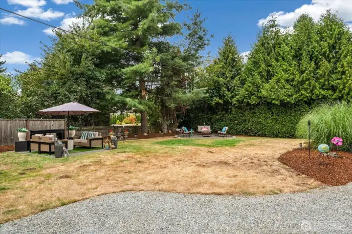 Not only a deck off the house, but two more patio spaces are in the front yard!