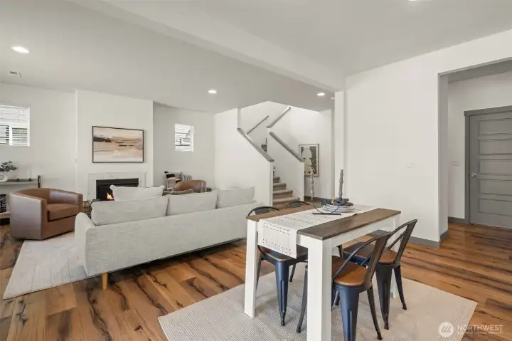The dining area sits between the kitchen and living area