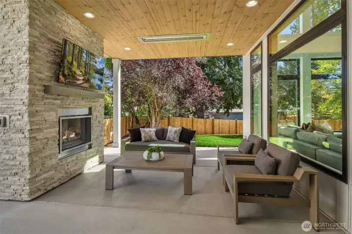 Private outdoor covered living area with fireplace