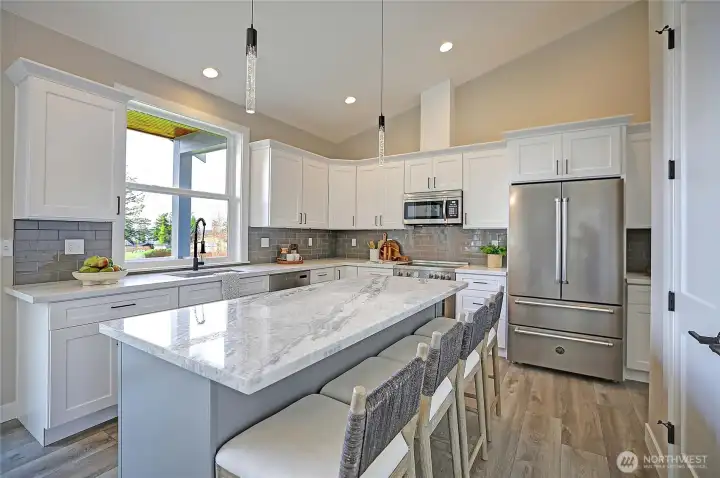 Chef’s kitchen featuring premium Bertazzoni appliances and sleek modern finishes