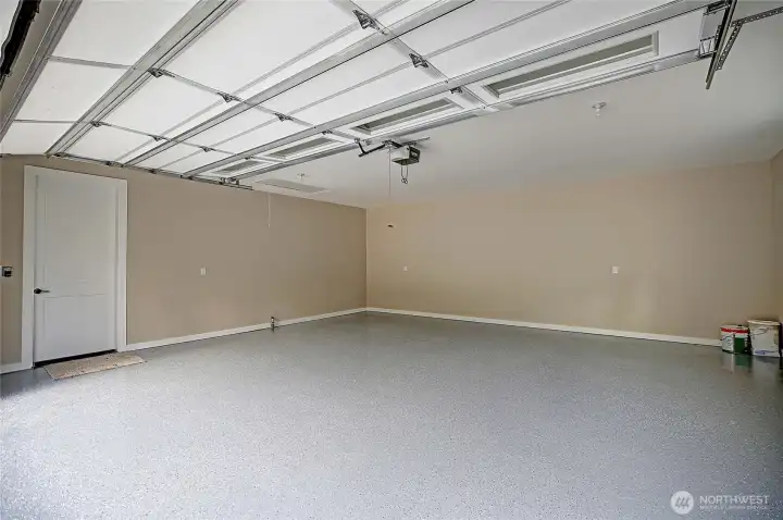 Large two car garage with epoxy floor. Lots of storage in attic space.