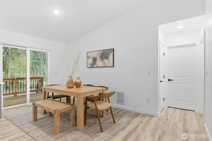 Dining area with slider to covered back deck & fully fenced back yard.