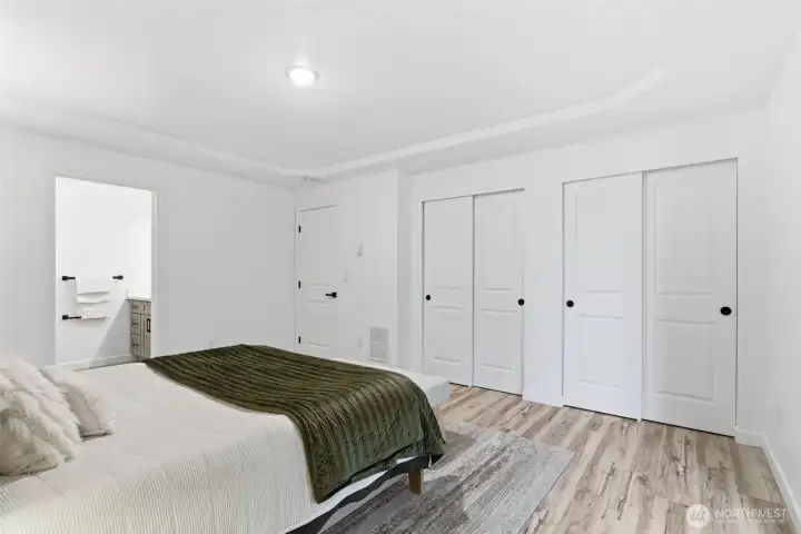 Dual closets and a full bath off the primary bedroom