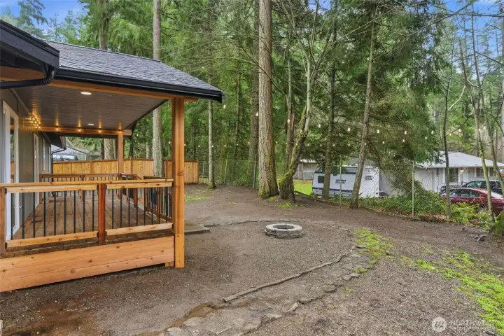 Cobblestone walkway & firepit installed. The back fence is cyclone and could be made into a privacy fence a number of ways.