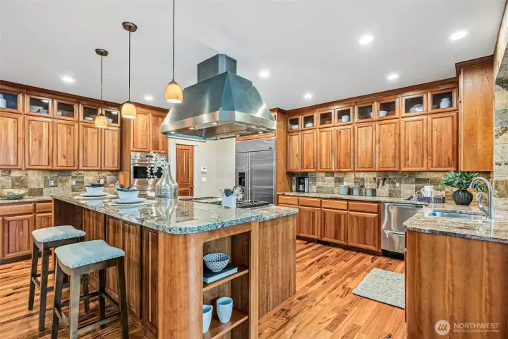 Abundant Cabinetry Featuring Display Windows and Shelves!