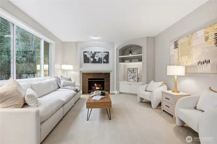 Handsome curved built-in and gas fireplace.