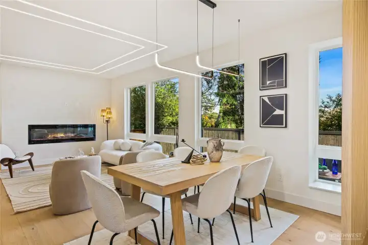 Elegant dining space featuring designer lighting, ideal for both intimate dinners and large gatherings.