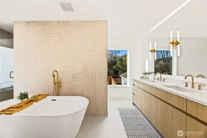 Spa-like primary bathroom with a standalone soaking tub and oversized walk-in shower.