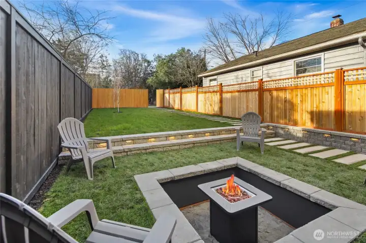 Manicured garden beds and a private, fully fenced outdoor retreat.