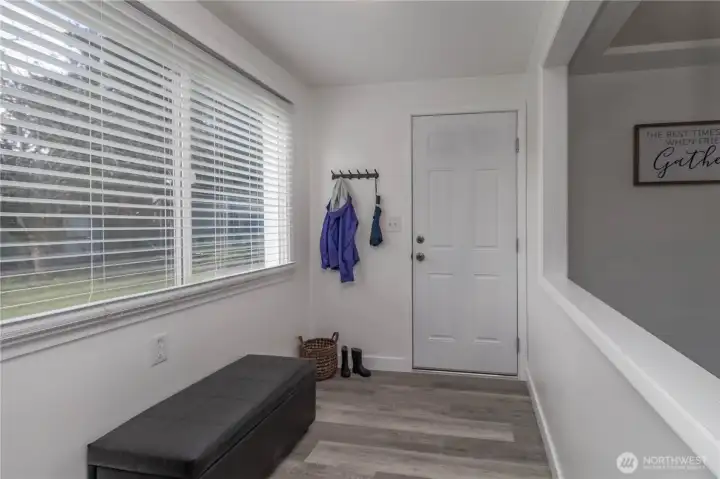 This cute little entry way from the garage can be a shoe storage or coat area!