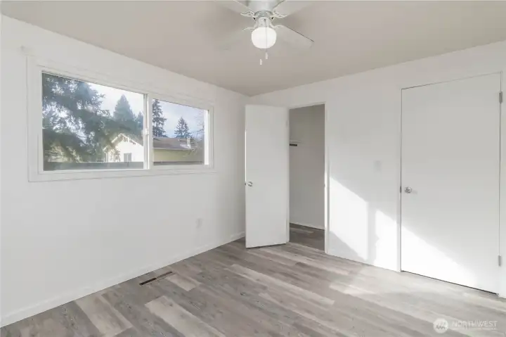 2nd bedroom, ceiling fan and view of the back yard!