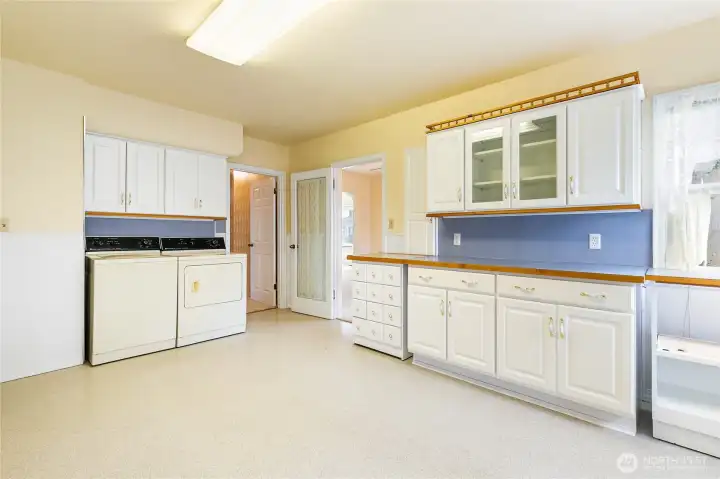 A glass door gives the dining room privacy for a formal dinner...follow the other door to the hallway, more storage and the bedrooms.