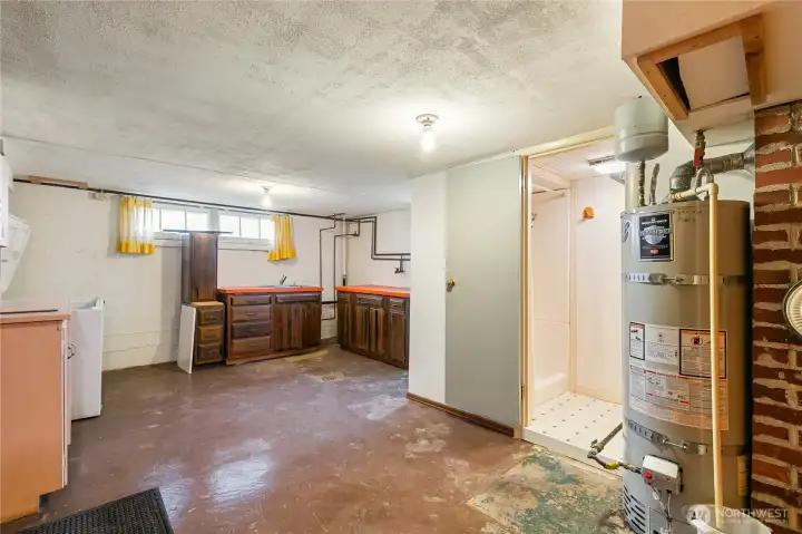 Once this was the utility until that was moved up. Now a storage room with the included freezer...It has a 3/4 bath with sink in the larger room. This would make a great canning room...