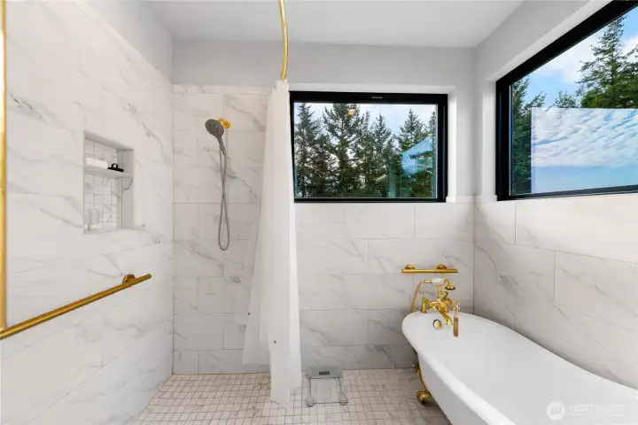 Claw-foot tub and zero step into shower.