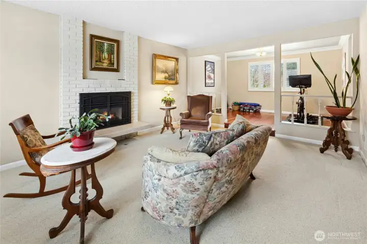 Spacious living room with cozy fireplace.