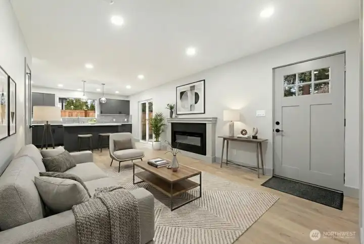 Light, bright open floorplan with 8' ceilings, cozy fireplace and wideplank floors,