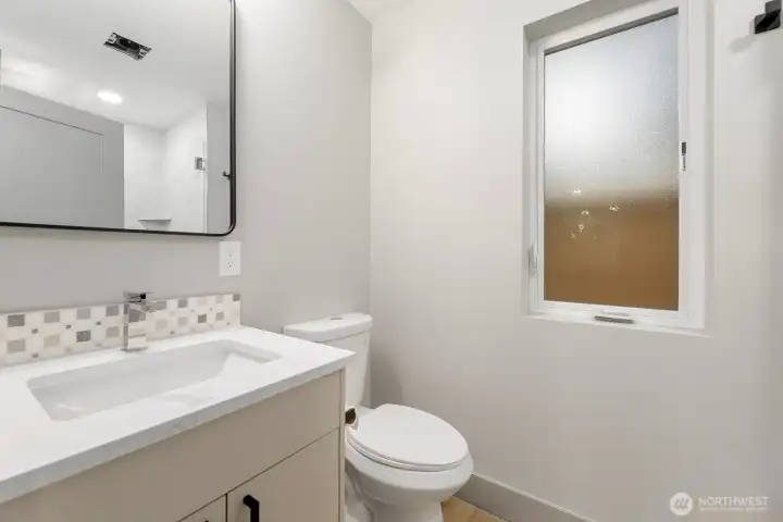 Main floor 3/4 bathroom with luxury shower and appointments