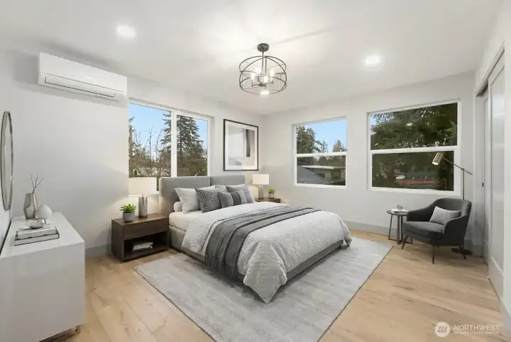 Upper level primary suite with Mini-Split heating and cooling and light, bright windows.