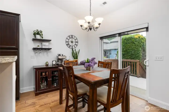 Dining area opens to deck and kitchen.