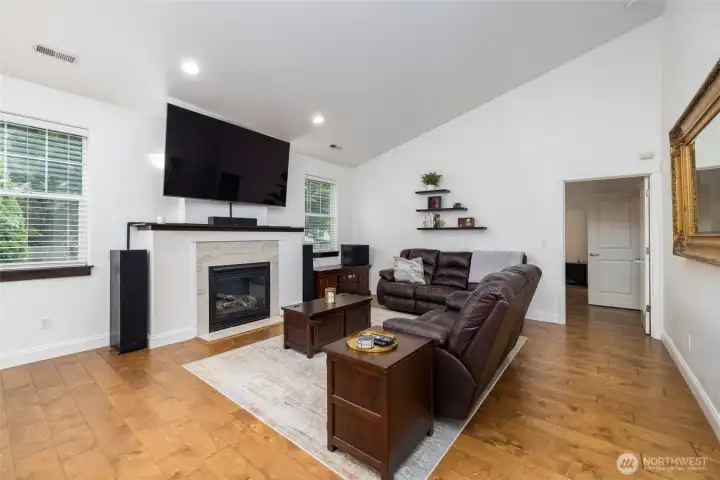 Vaulted ceilings in open concept living area.