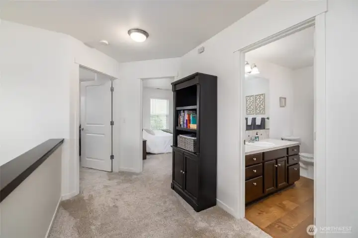 Upstairs landing, has linen closet, open to entryway below.