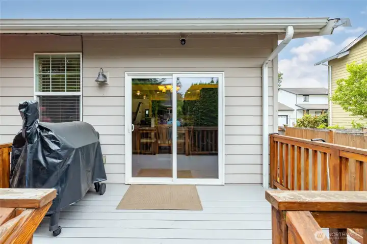 Back deck with slider door to dining room/kitchen.