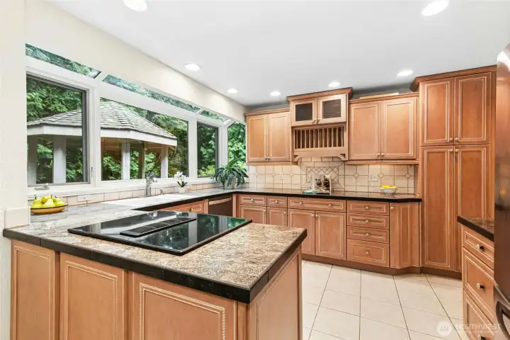 Kitchen features granite tile countertops. Kitchen features granite tile countertops.