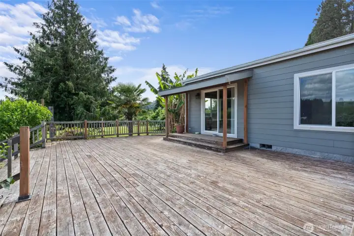 Enormous deck spans front of house