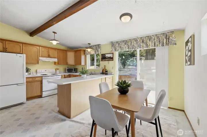 Bright & Sunny Kitchen with dining area & slider to Backyard Patio