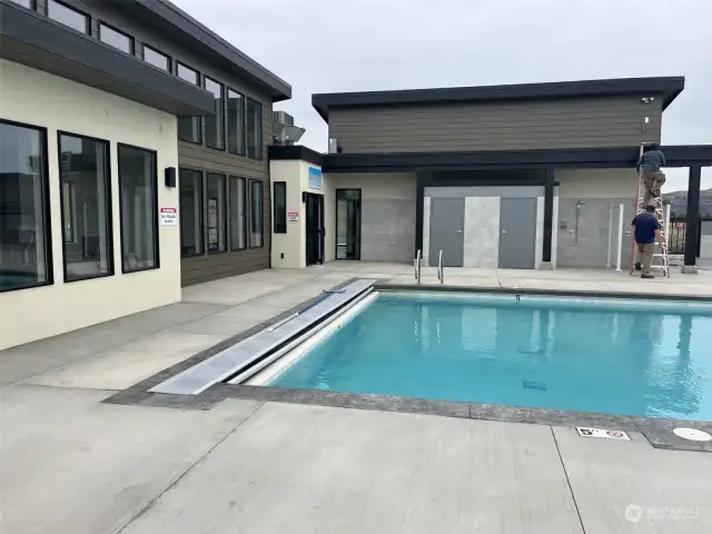 Pool deck with out door showers.