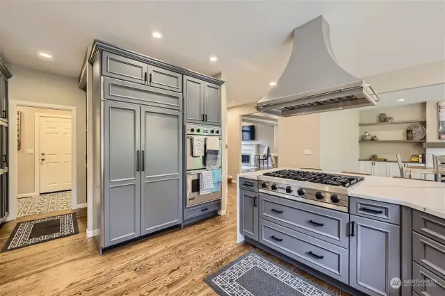Another view of this fabulous chef's kitchen with the cabinet-faced SubZero, double oven, beautiful Canyon Creek cabinetry, all flowing into the greatroom for casual entertaining.