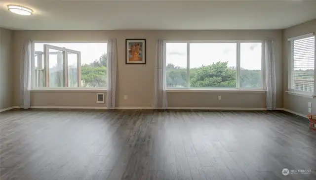 Filled with light, the spacious living/dining room is a perfect gathering place