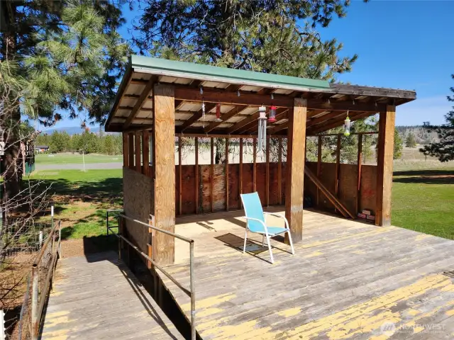 Enclosed area on the deck. Ramp for easy access.