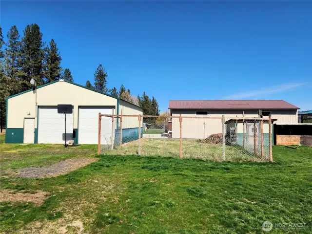Large 2 car garage, fenced garden area & storage shed.