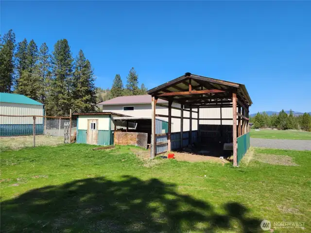Storage shed and carport area.