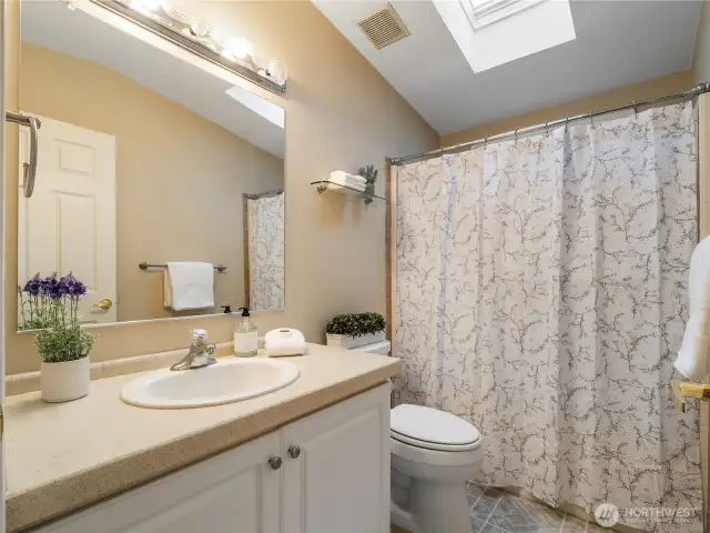 Hall Bath with tub/shower enclosure.