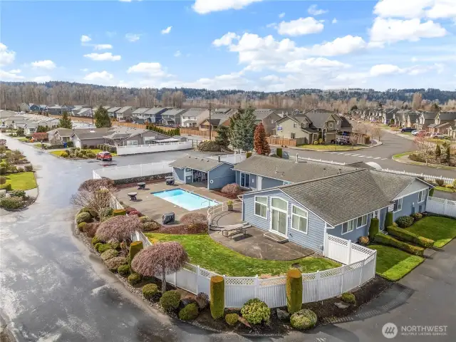 Community clubhouse with kitchen, exercise room, game room, and outdoor pool.