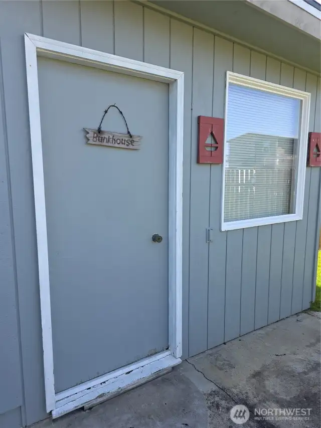 Door leading to Bunk House off back patio.