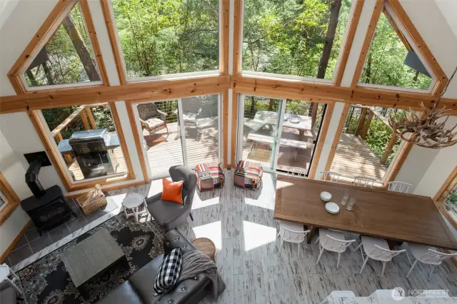 Stunning view from the upstairs loft area that overlooks the living room, dining room and exterior deck.