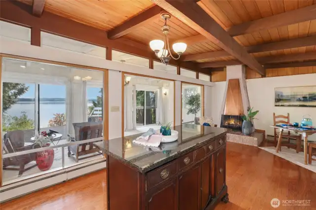 Kitchen with indoor sunroom with views to the bay and Mt Rainier