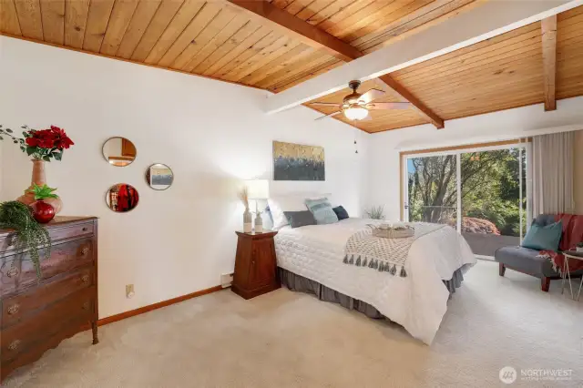 Primary room with sliding doors upon deck and amazing views of bay