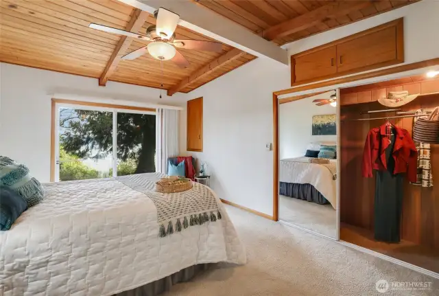 Primary room with 2 closets and sliding door to backyard and bay