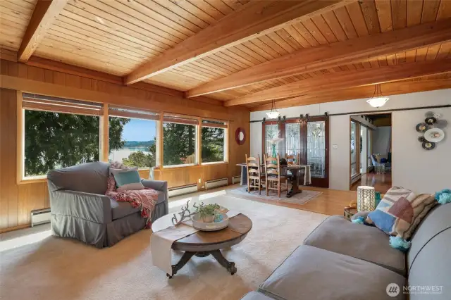 Living room with views of bay. Gliding antique doors