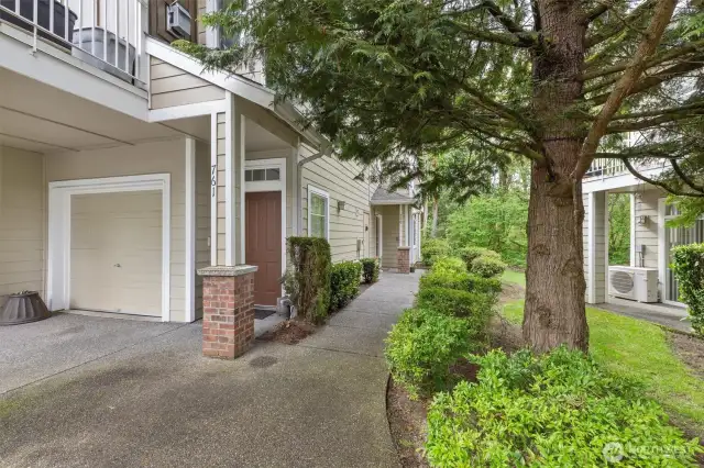 A beautiful setting welcomes you home. Continue down the sidewalk to reach this unit (759).