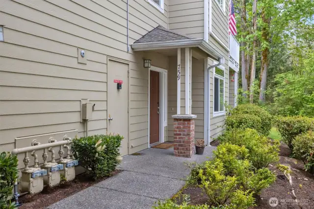 Unit 759 with a covered front porch to protect you from the elements.