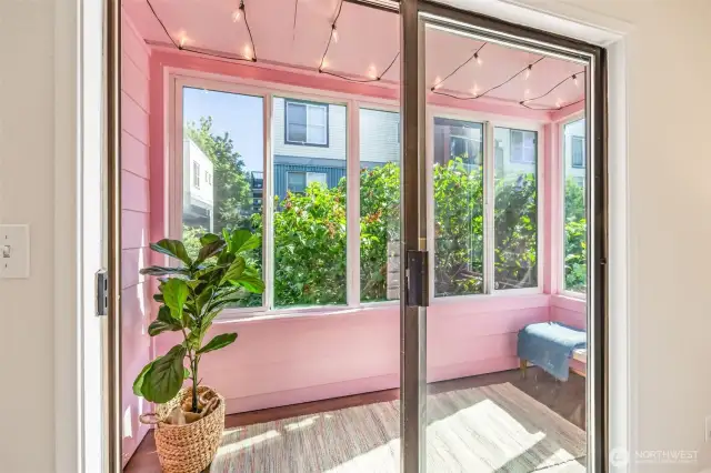 Enclosed sunroom of larger bedroom.
